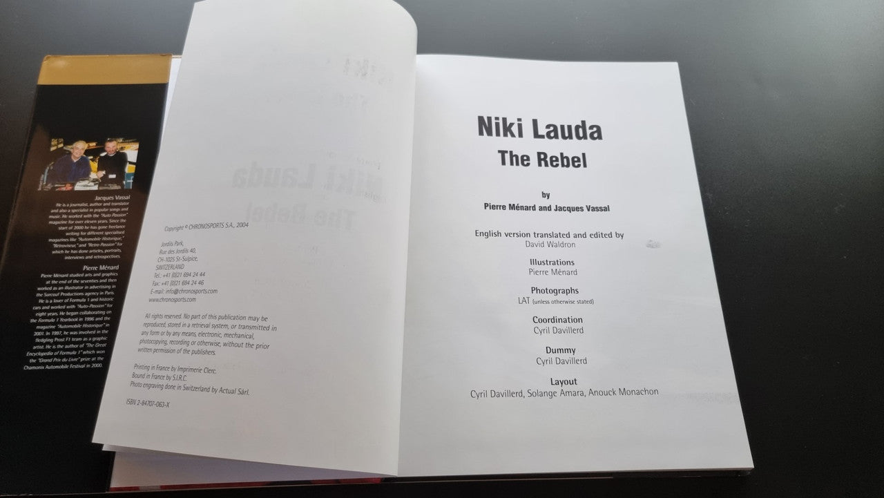 Open biography book with printed text pages and title page on right