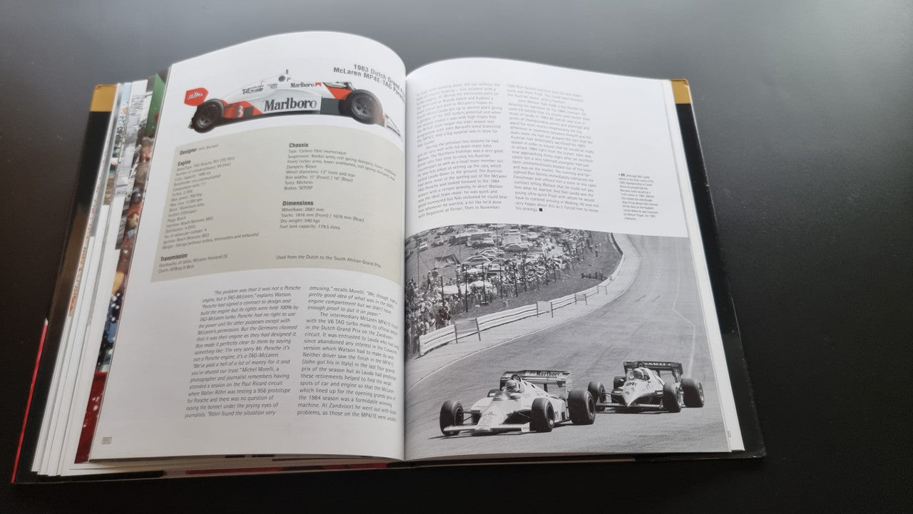 Open biography book with race track photo spread and text paragraphs