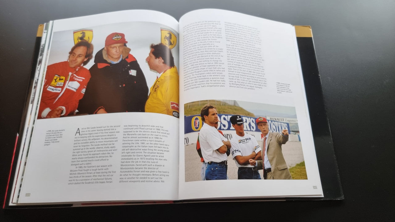 Open biography book with color team portraits and action photo on right page