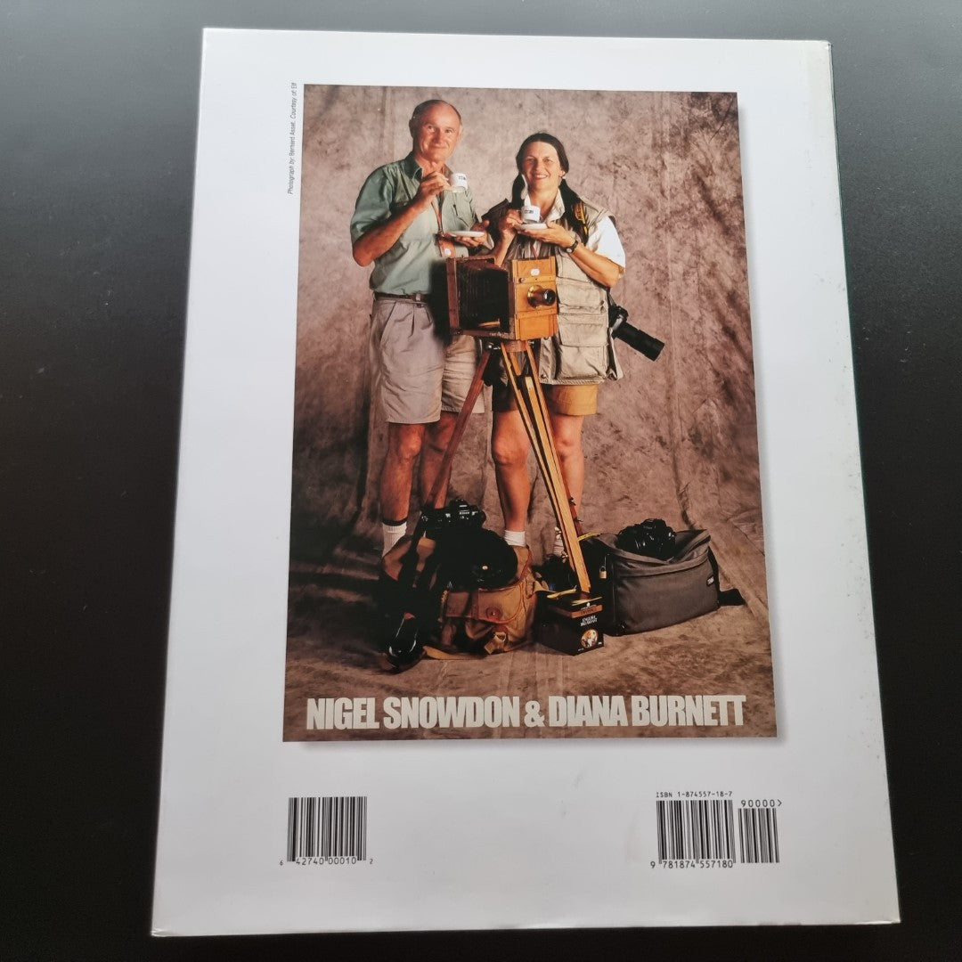 Motor sport photography book back cover with two people holding a camera setup
