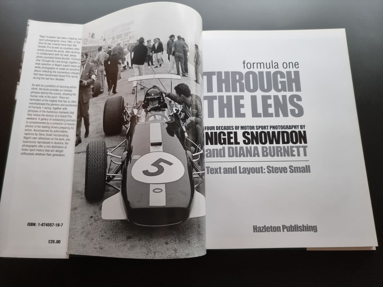 Open motor sport photography book showing race car photo and title on facing page