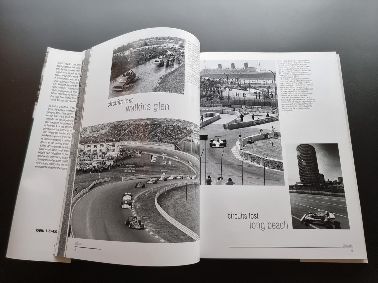 Open motor sport photography book with race circuit photo spread and captions