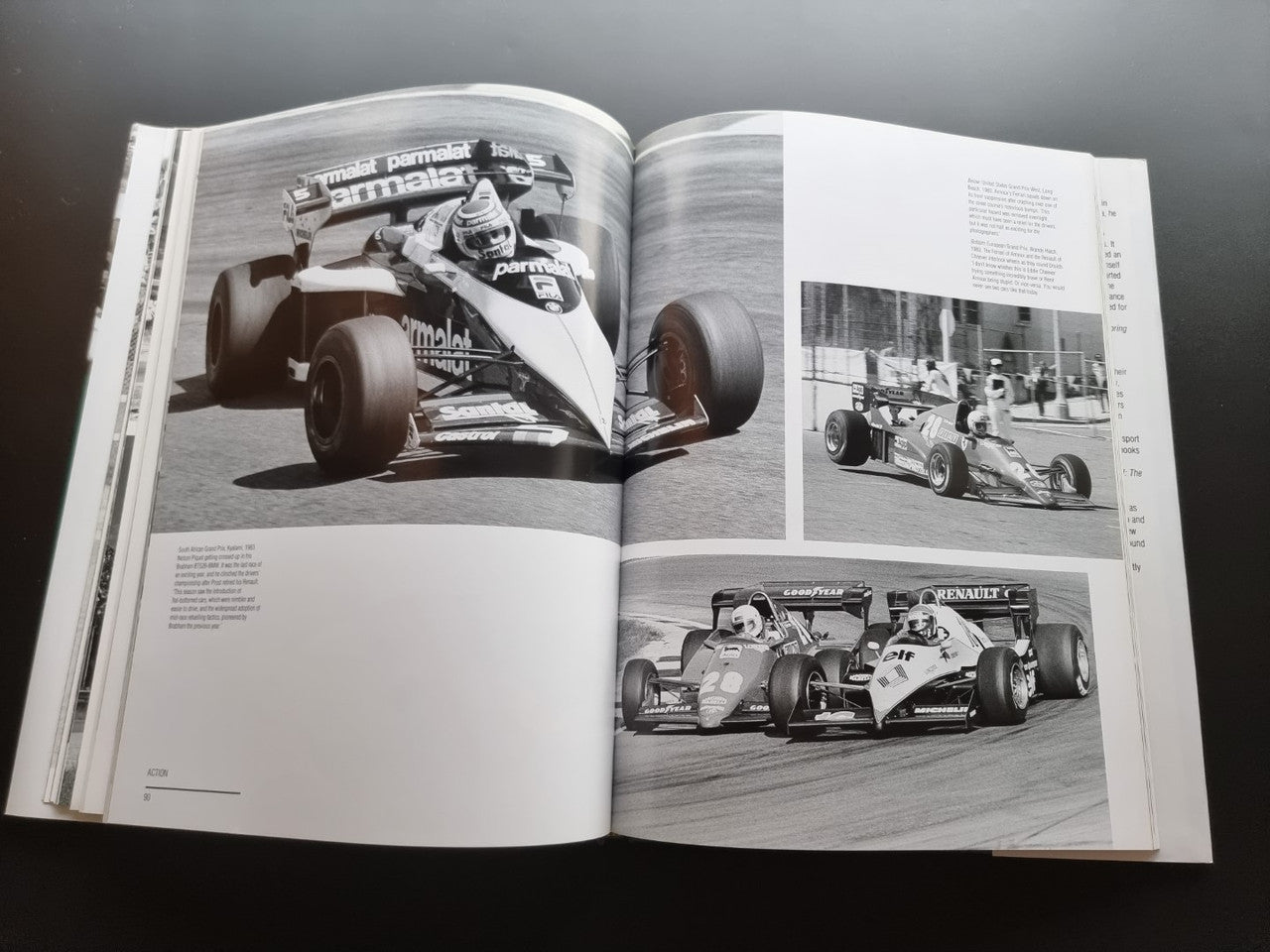 Open motor sport photography book with black-and-white race cars on two pages