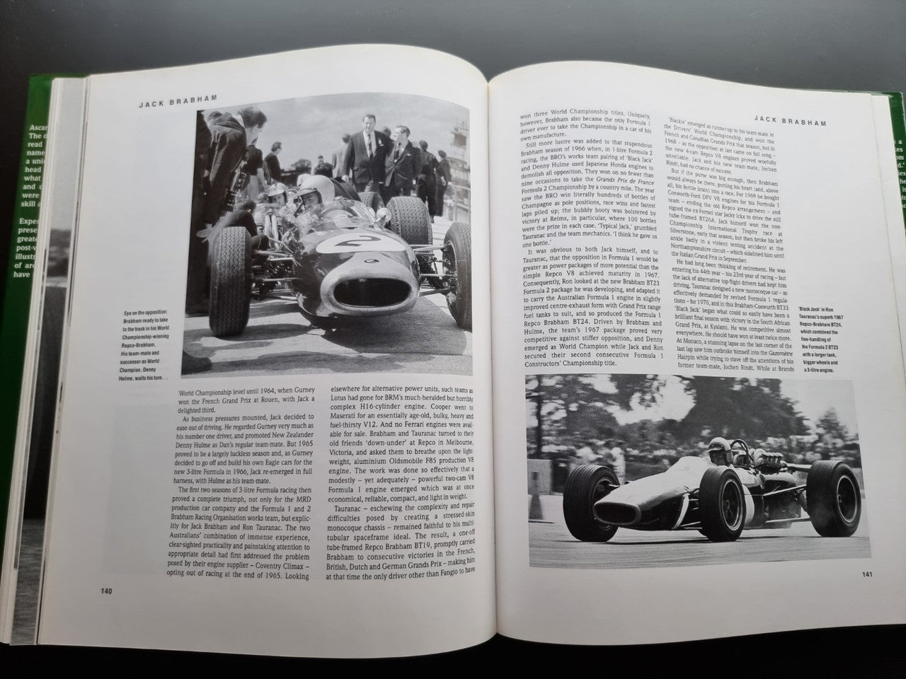 Open motorsport history book with black-and-white Formula 1 car race photos on both pages
