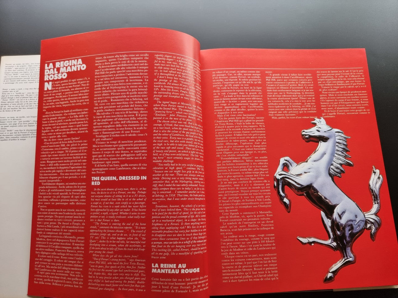 Red year book page with white horse illustration and racing text