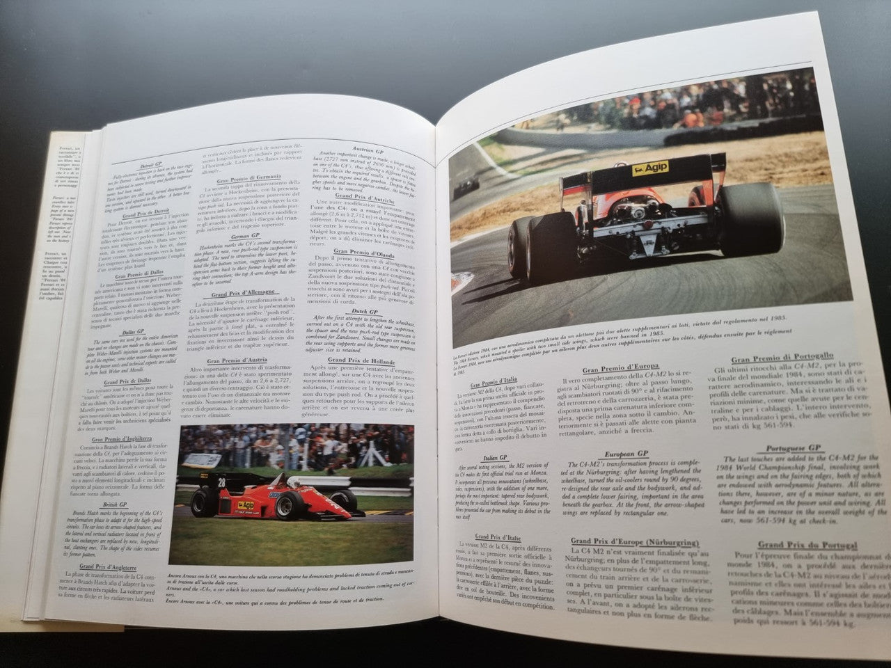 Open year book with racing photos on two facing pages
