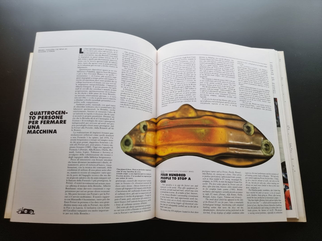 Ferrari year book opened with a bronze-colored Ferrari badge illustration