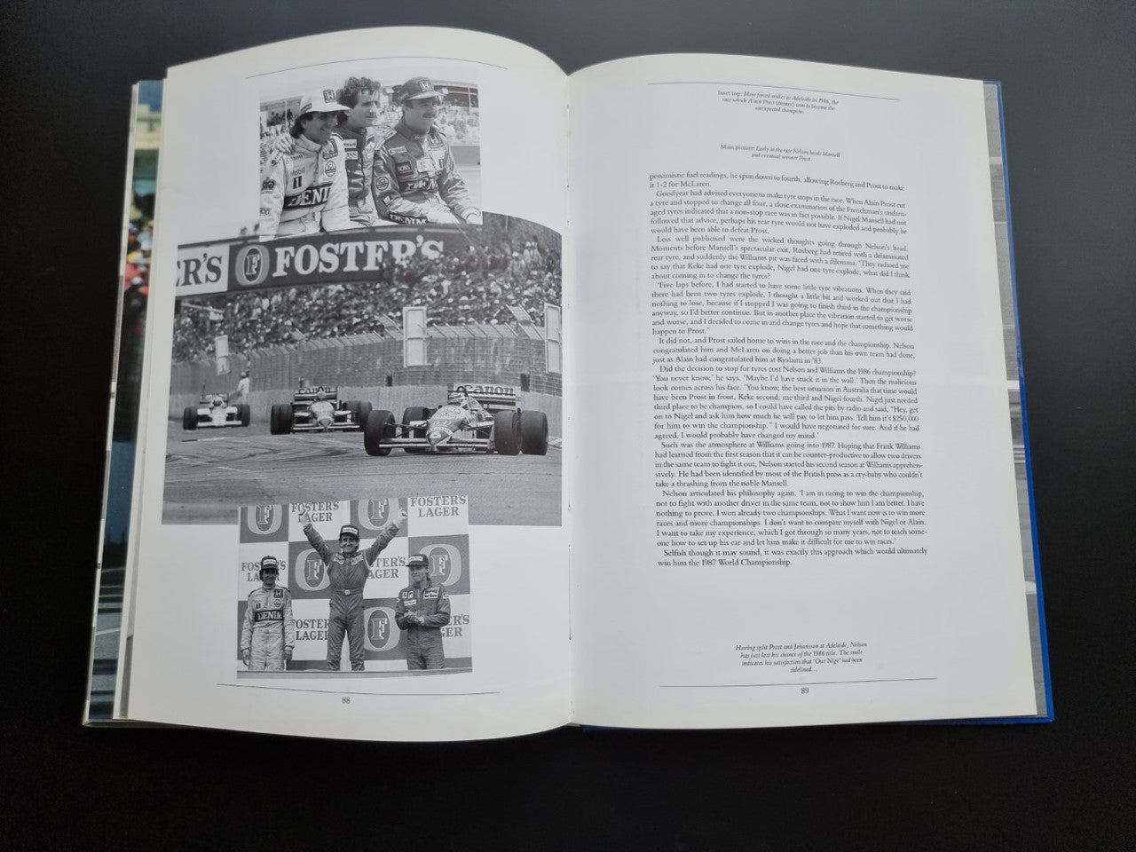 Open motorsport book pages with black-and-white racing scene and crowd photos