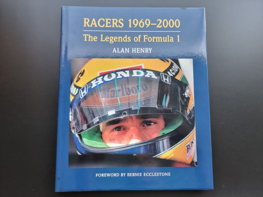 Motorsport book cover with helmeted driver photo, blue text and author name Alan Henry