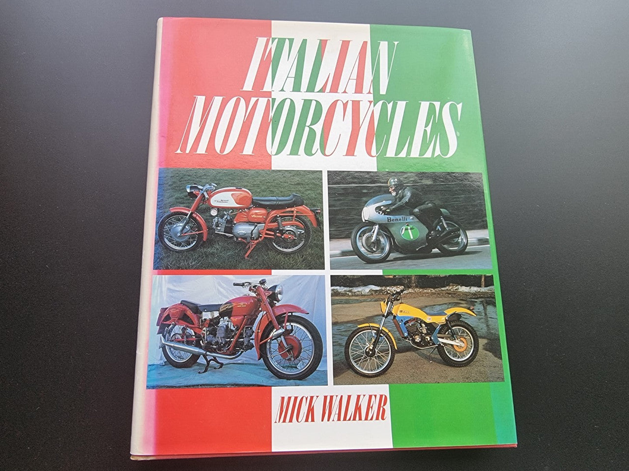 Motorcycle history book cover with large title and four motorcycle image panels