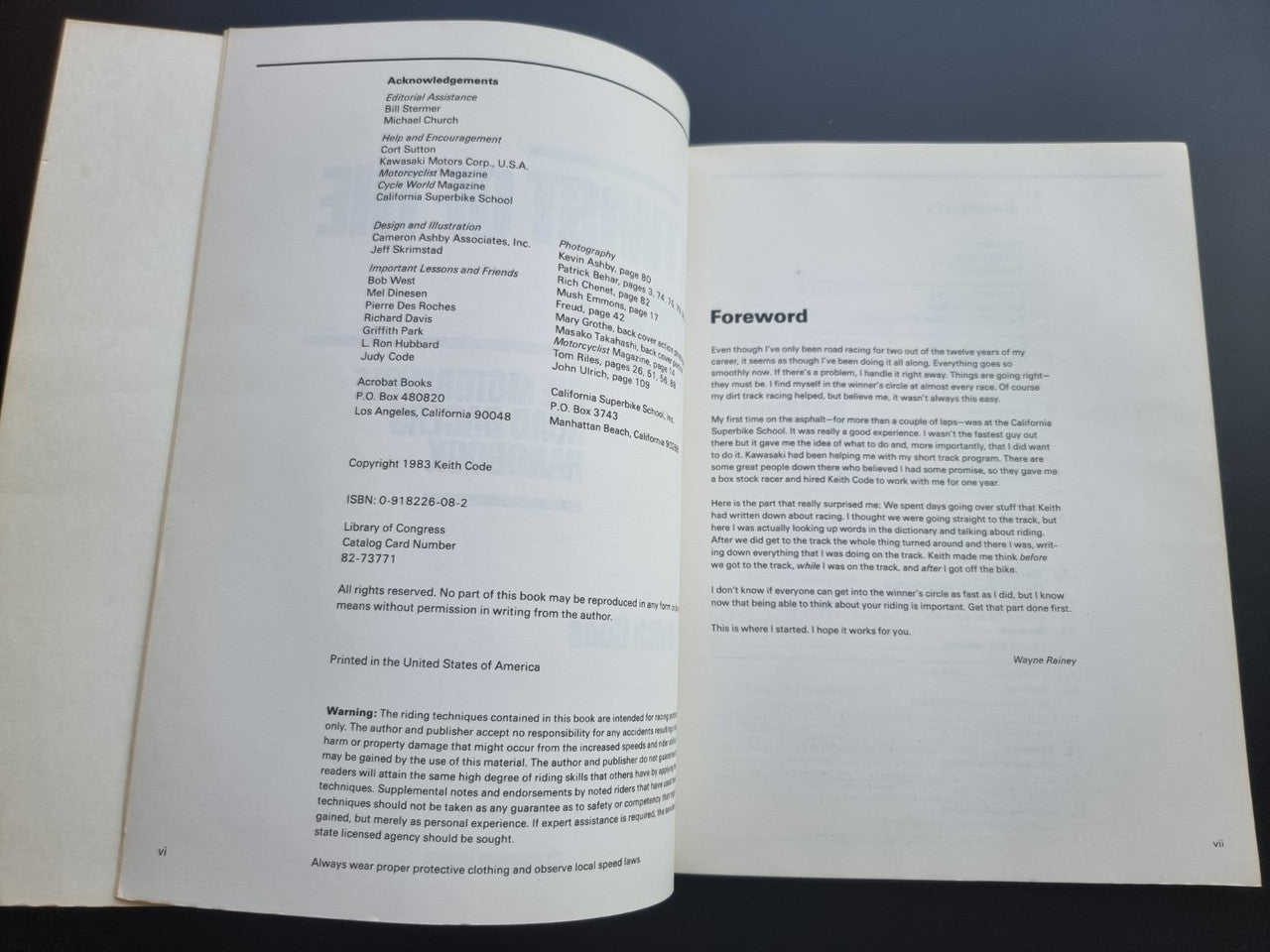 Open book spread with section titles and paragraphs of printed text
