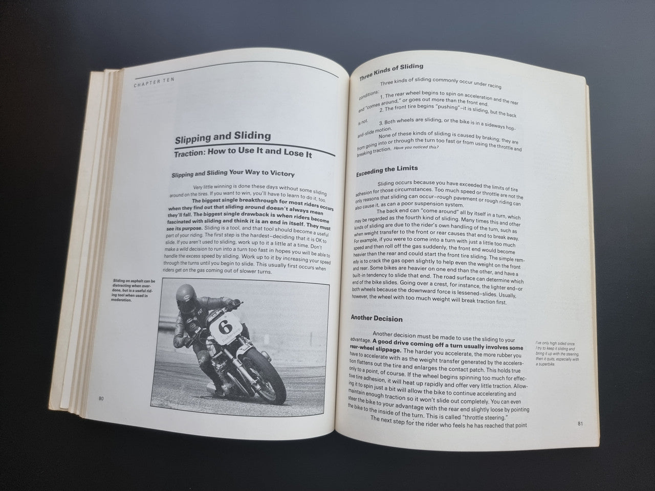 Open book spread titled “Slipping and Sliding” with grayscale motorcycle photo and text