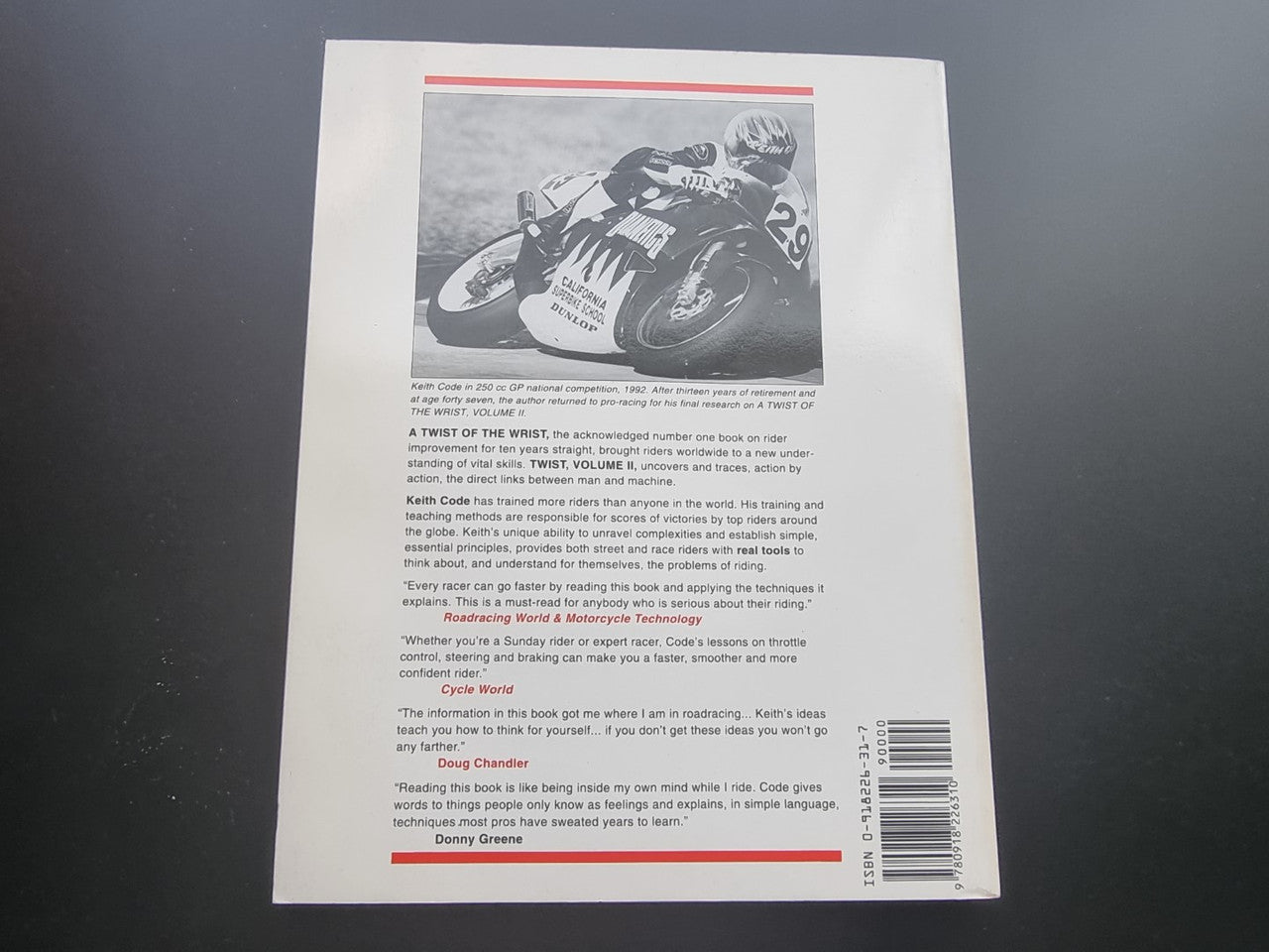 Motorcycle riding guide paperback, back cover with text block, small bike photo, and barcode.