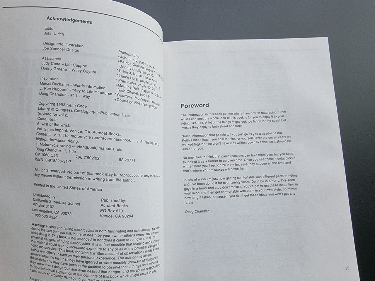 Motorcycle riding guide paperback, open spread showing foreword and acknowledgements text.