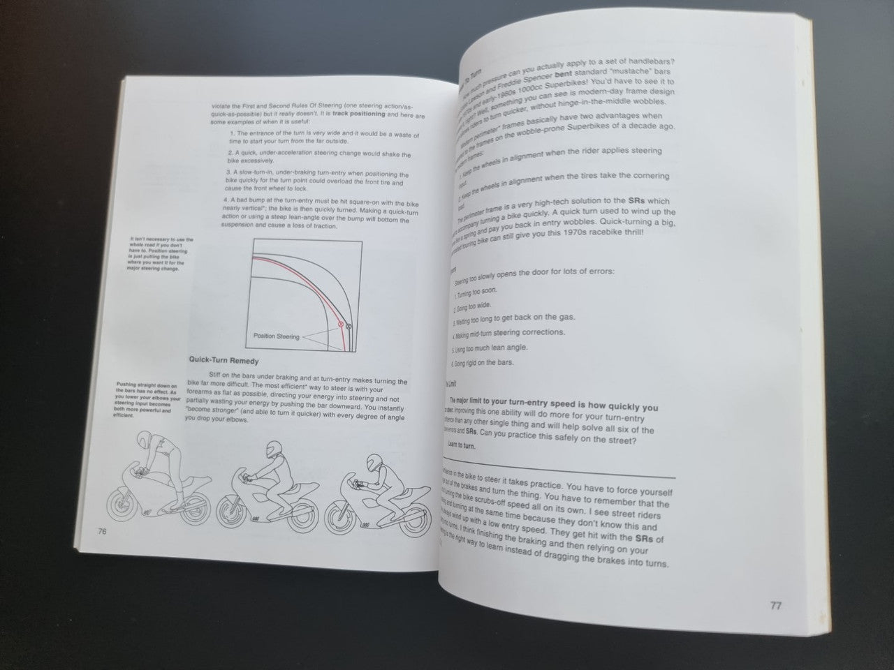 Motorcycle riding guide paperback, open spread with rider diagrams and labeled graph.