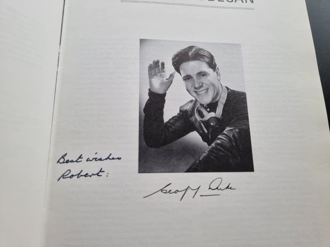 Signed page with Geoff Duke portrait photo and handwritten signature