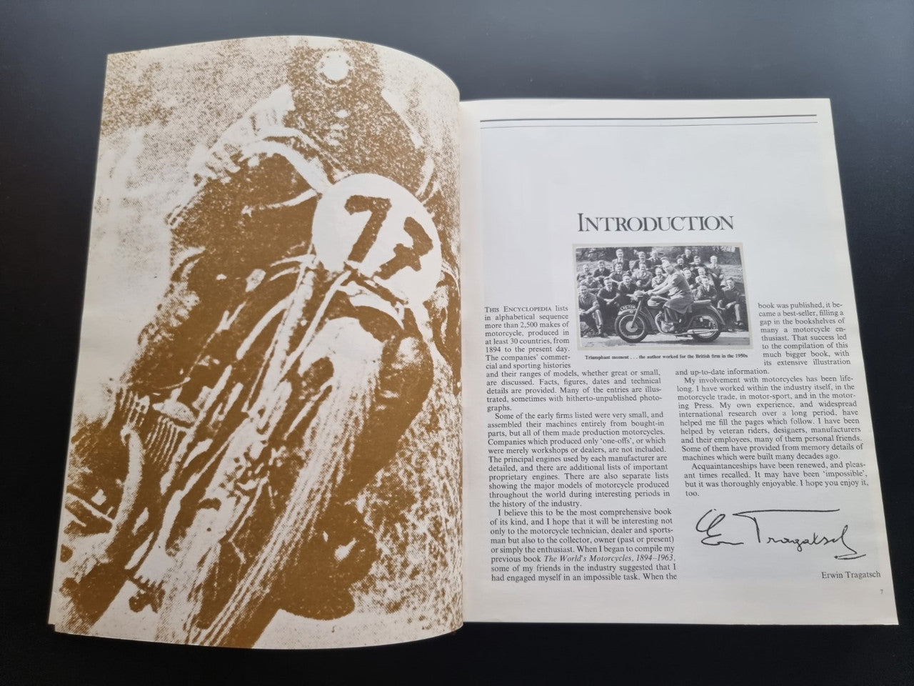 Open book with sepia motorcycle illustration and Introduction text