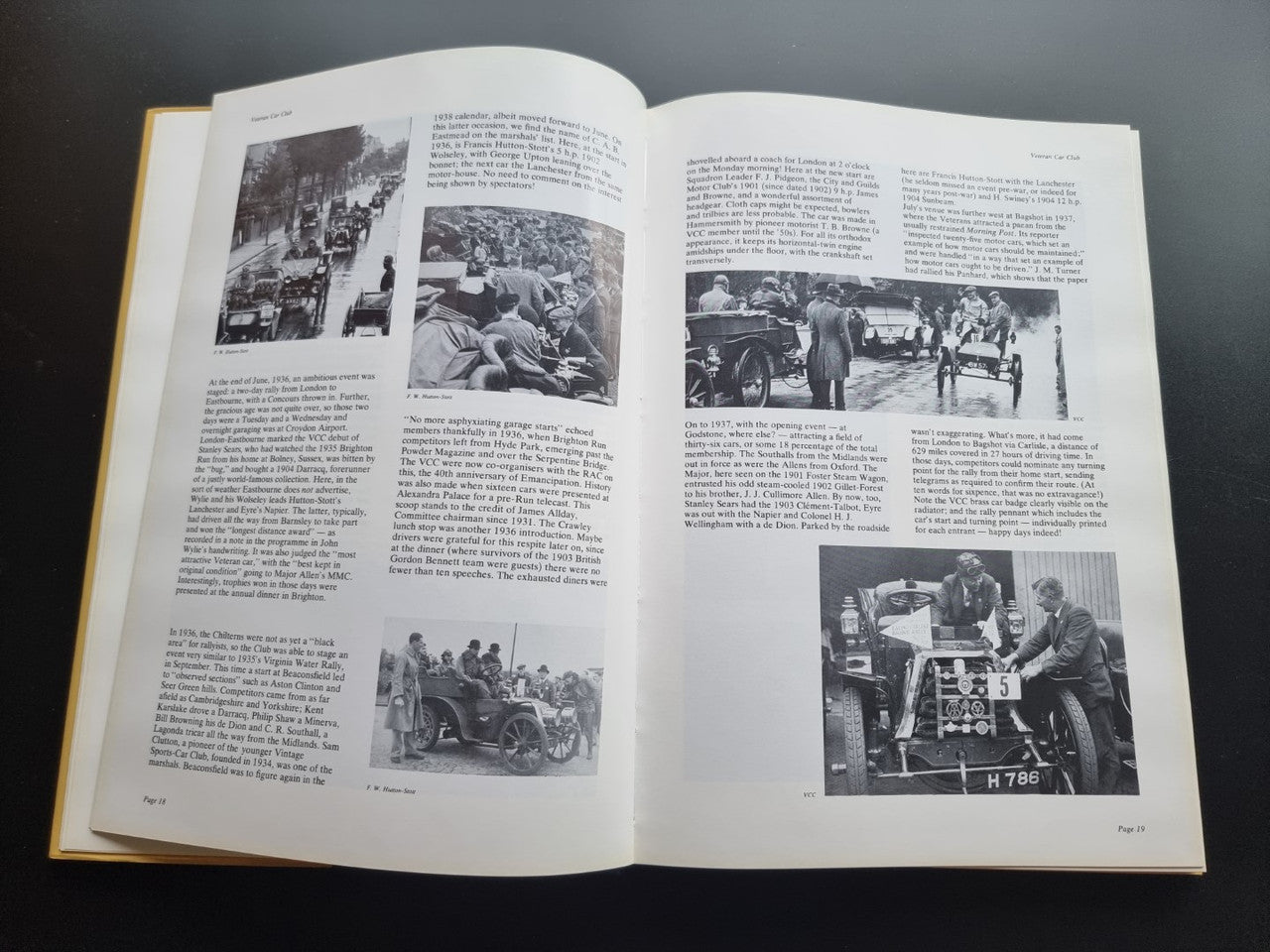 Open pictorial history book spread with multiple black-and-white crowd and car photos
