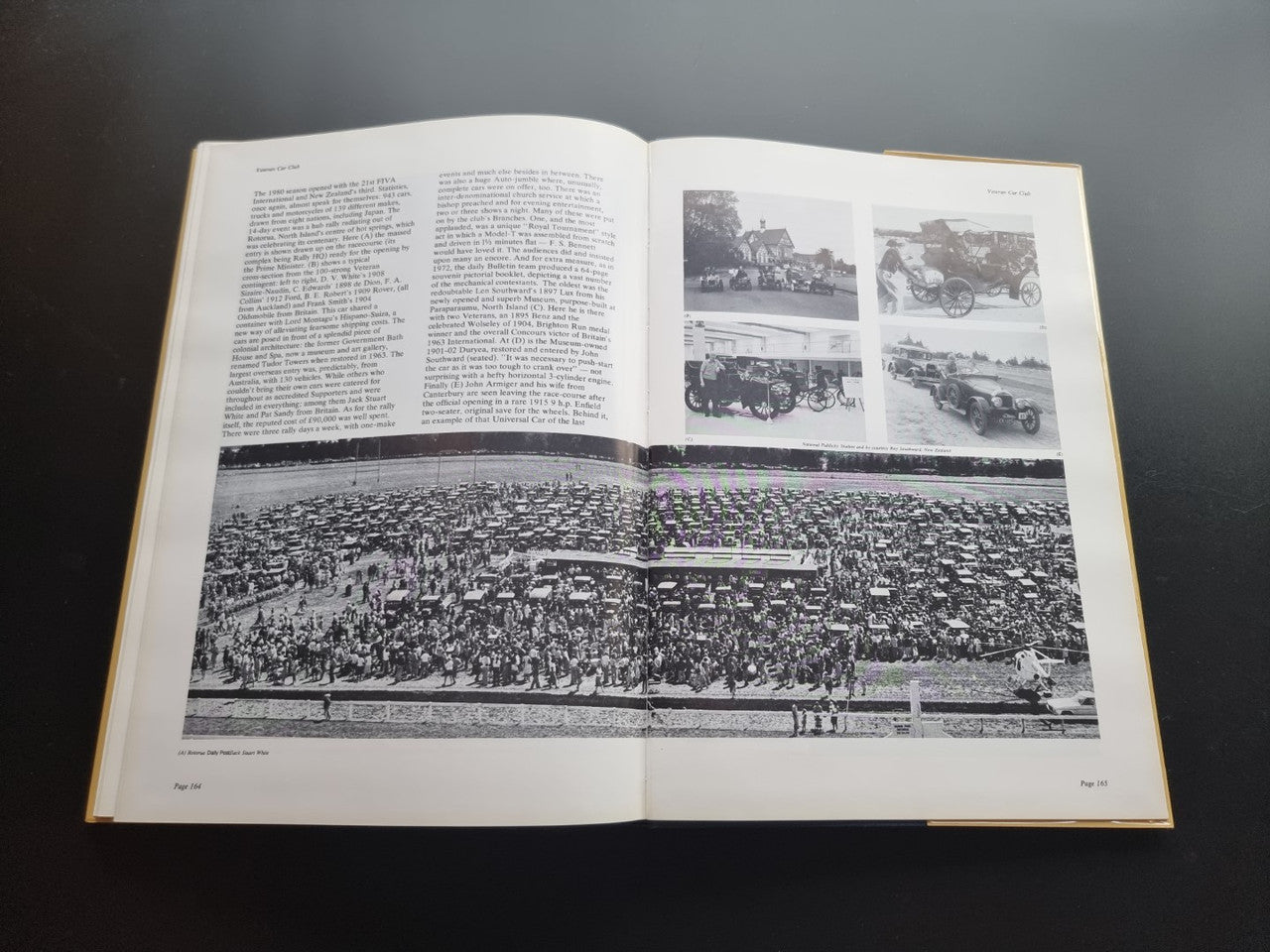 Pictorial history book, open spread with vintage cars and large crowd photo