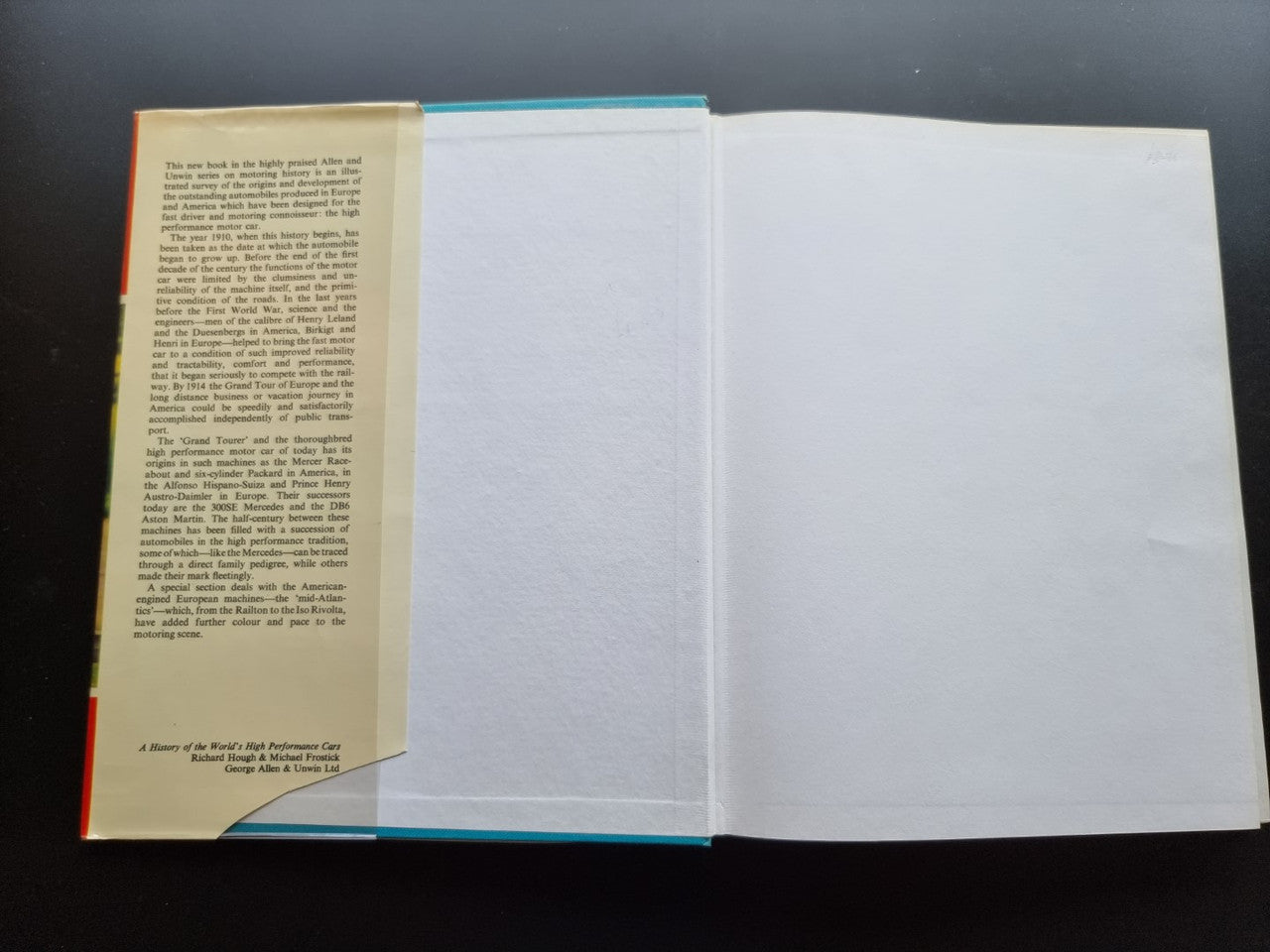 Open book with pages showing small printed text on the left and blank right page.