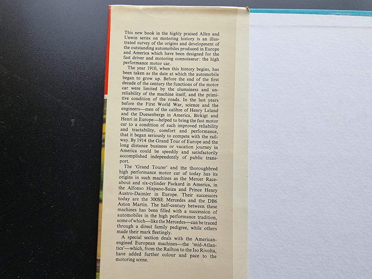 Close view of an open book page with printed historical text on the left side.