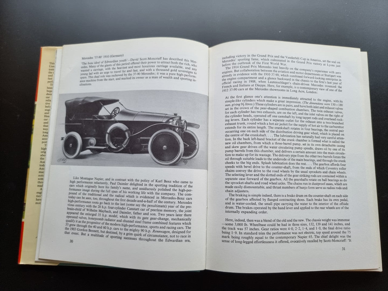 Open book spread with a black-and-white car illustration and body text on both pages.