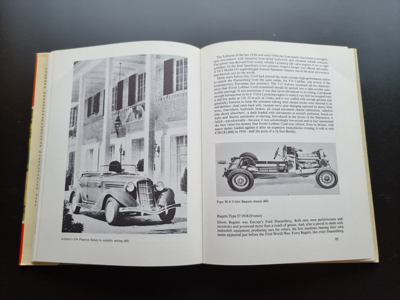Open book with text and black-and-white illustrations of a vintage car and city scene.