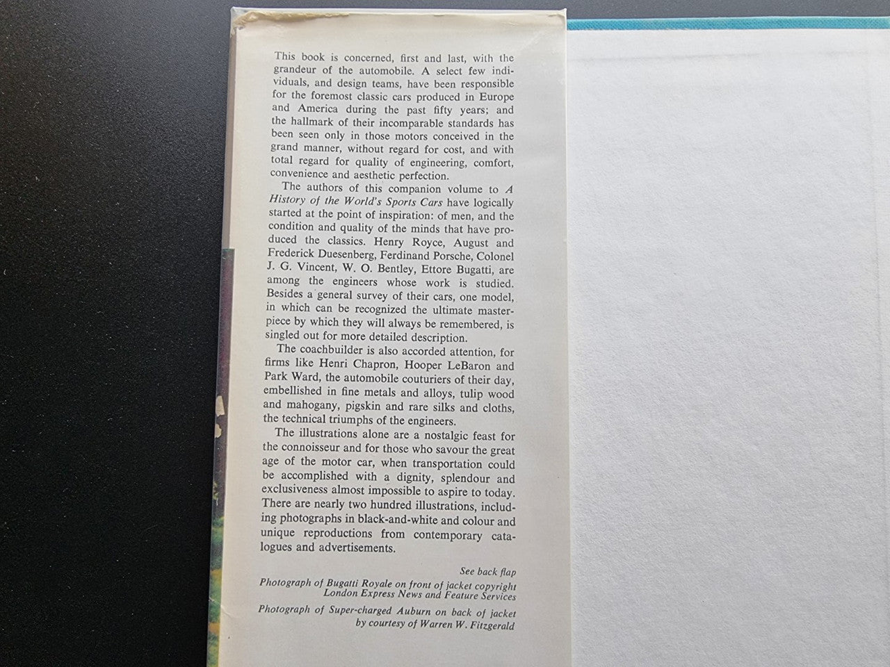 Classic car history book page view with dense paragraphs and small printed credits