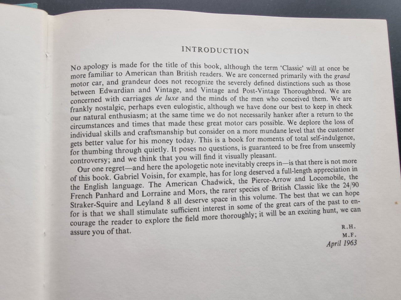 Classic car history book open to introduction page with dense printed text