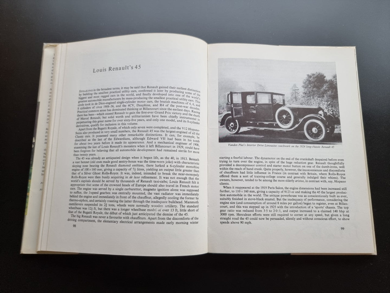 Classic car history book open to vintage car photo spread with captioned text