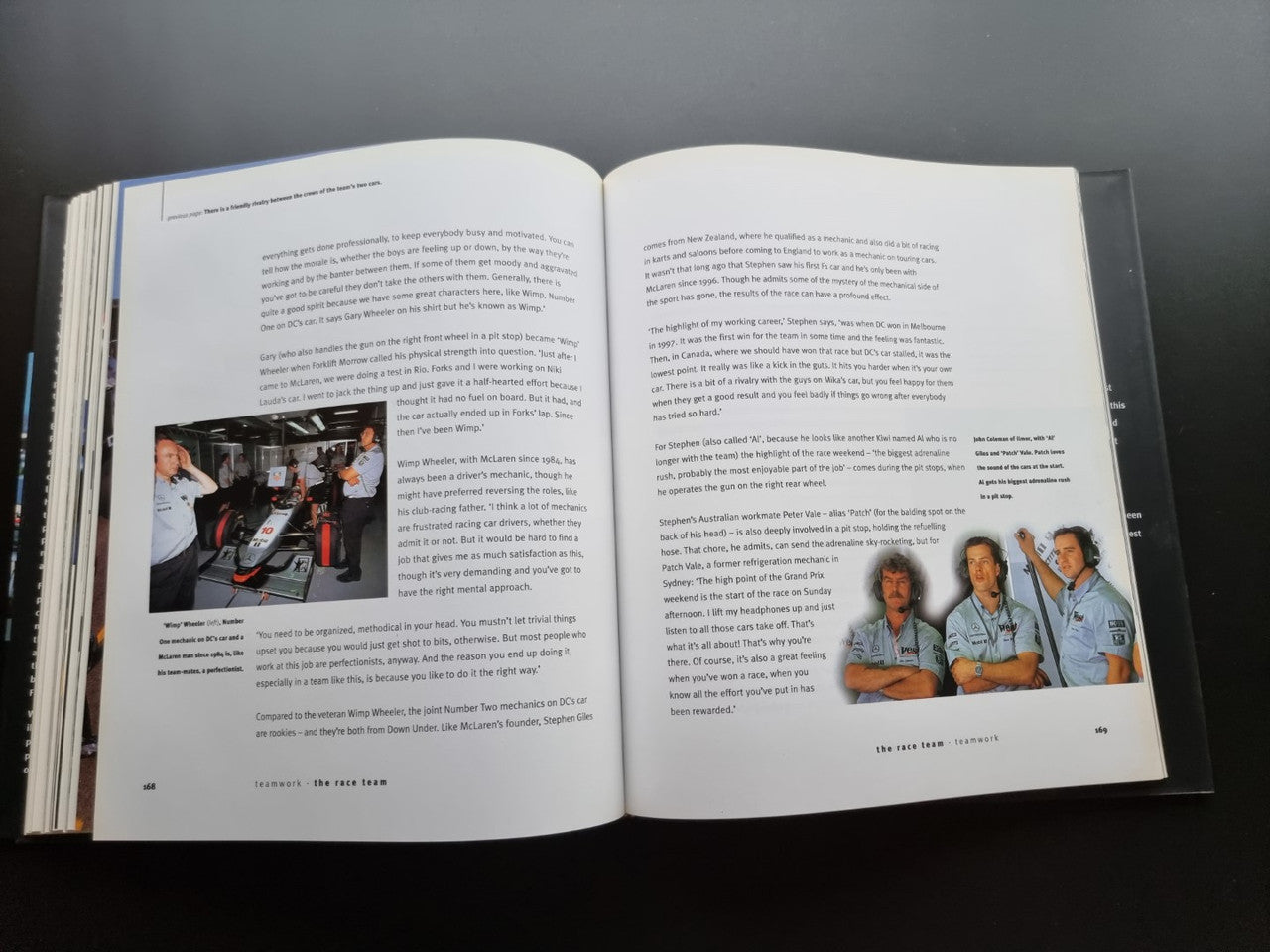 Open biography book with two text pages and small team photo captions