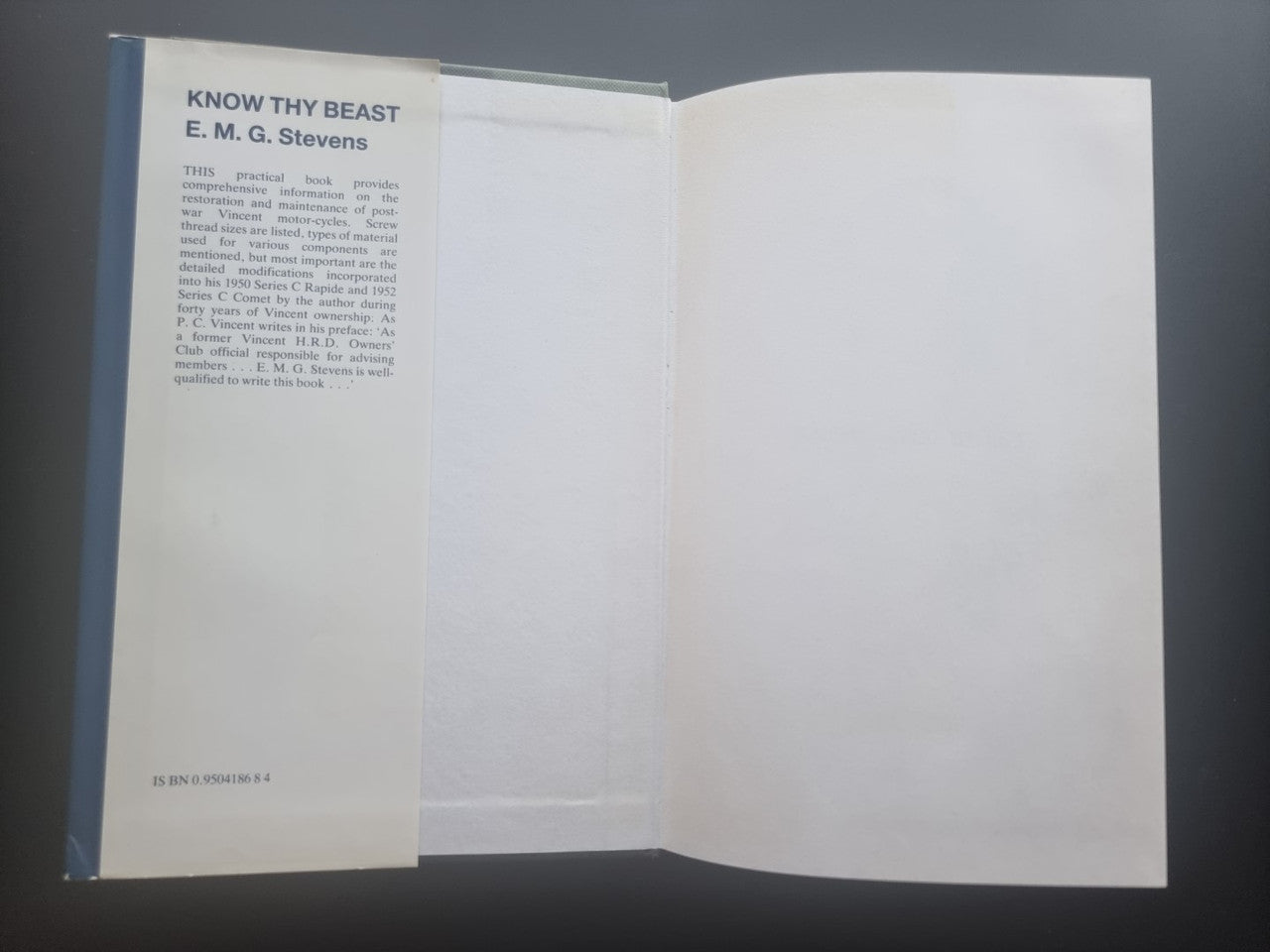 Open book with left page text and mostly blank right page
