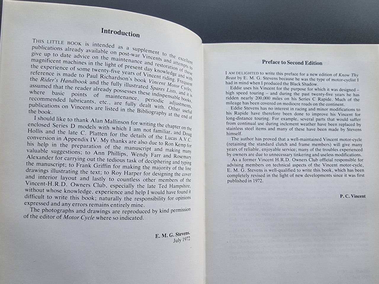 Motorcycle workshop book open to introduction pages with editor name and date