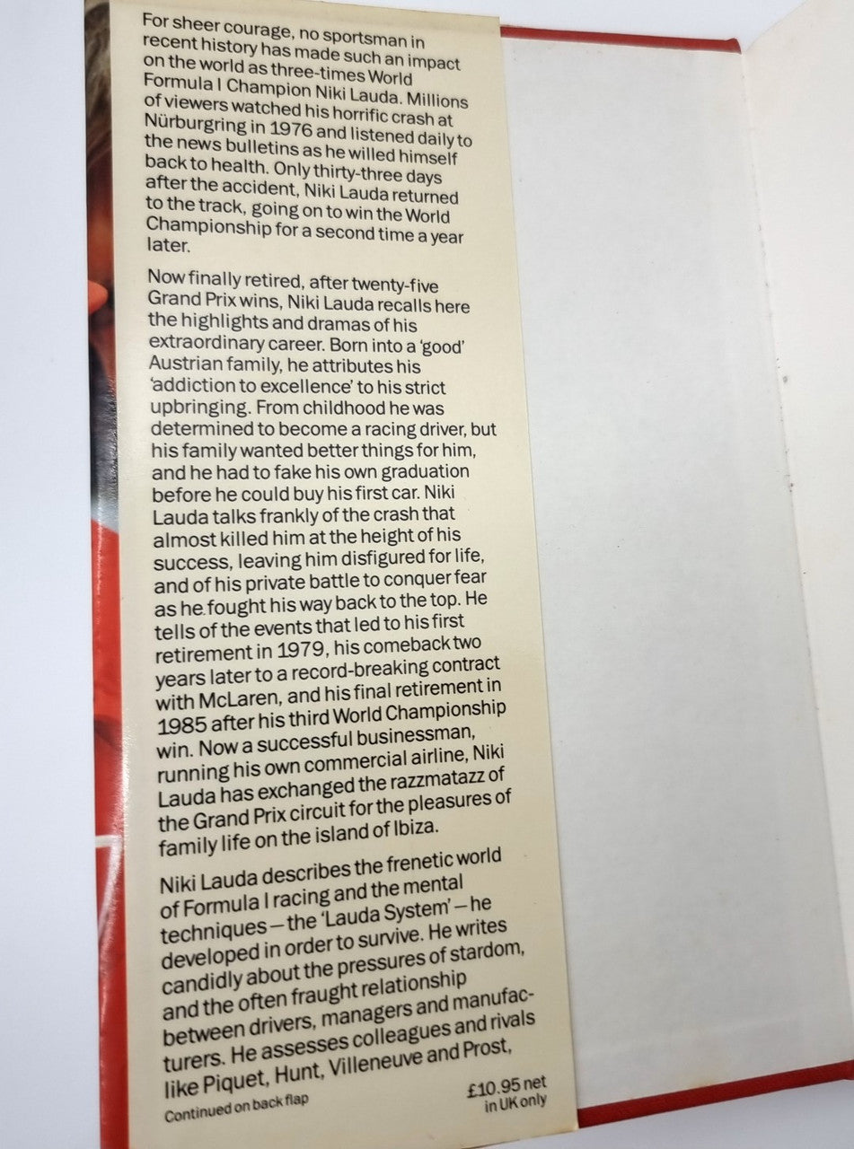 Open book page with dense black text and red vertical page border