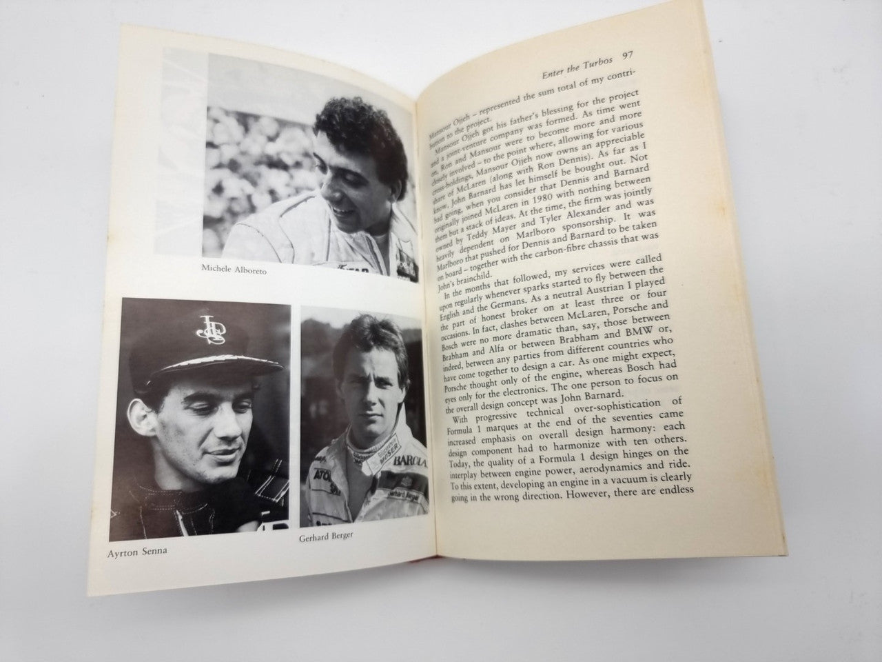 Open book spread with two racing portraits and text paragraphs on right