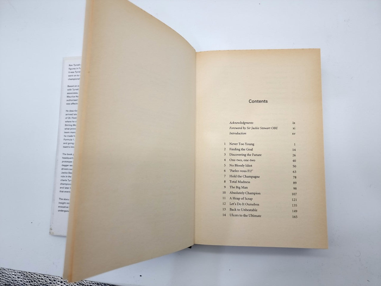 Book open to contents page with section list and page numbers