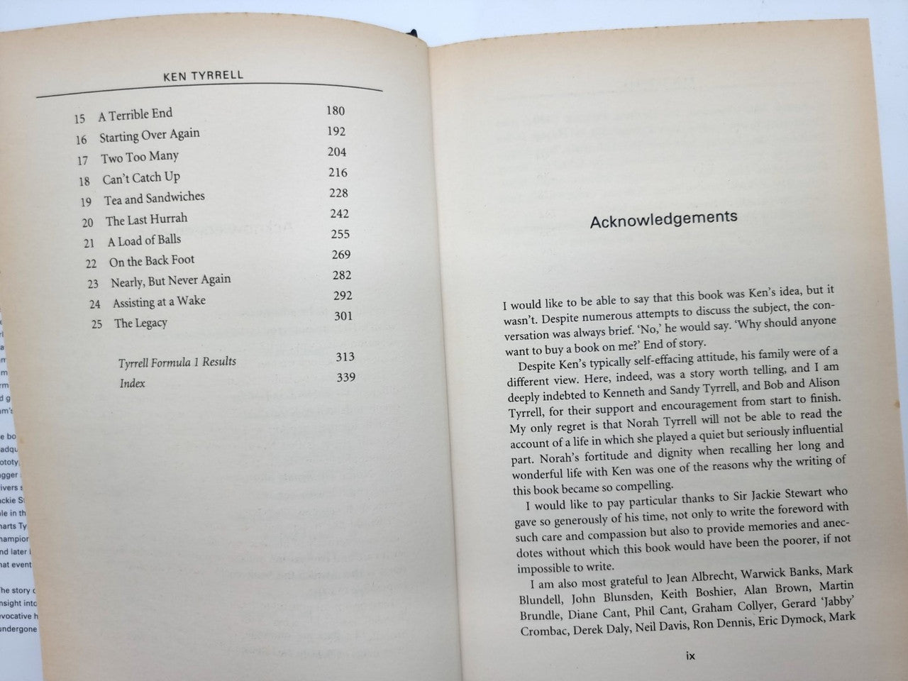 Book open to index list and acknowledgements heading on cream pages
