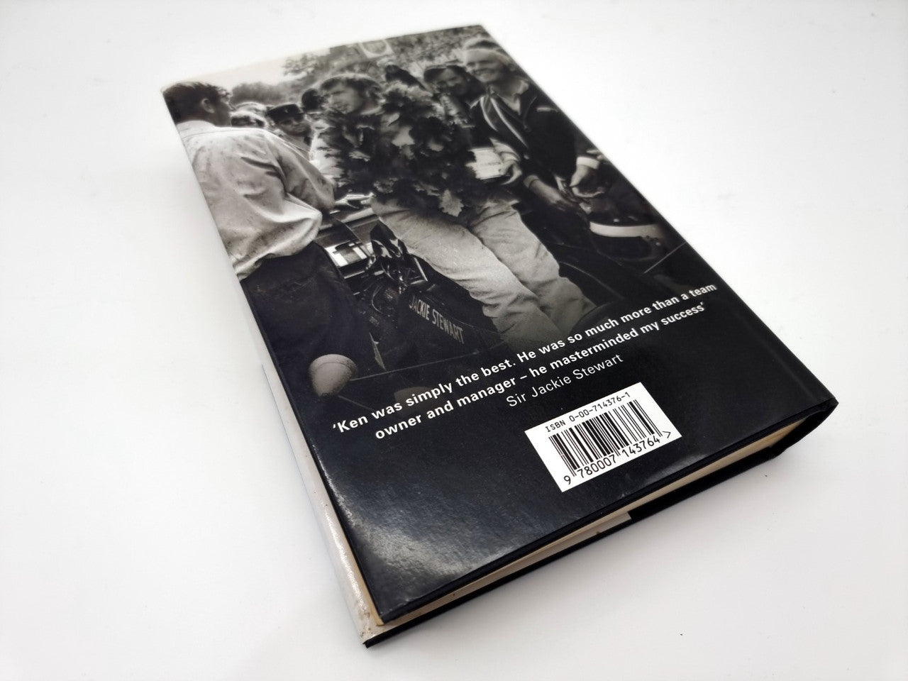 Motorsport biography back cover angled with quote text and barcode