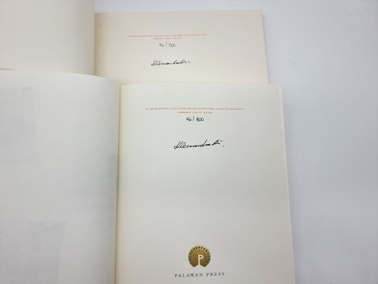 Open portfolio pages with handwritten signature and publisher seal at bottom