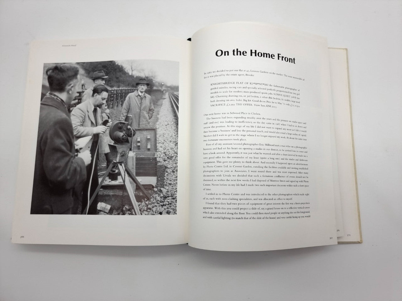 Open photo book with a black-and-white group image on the left and heading text