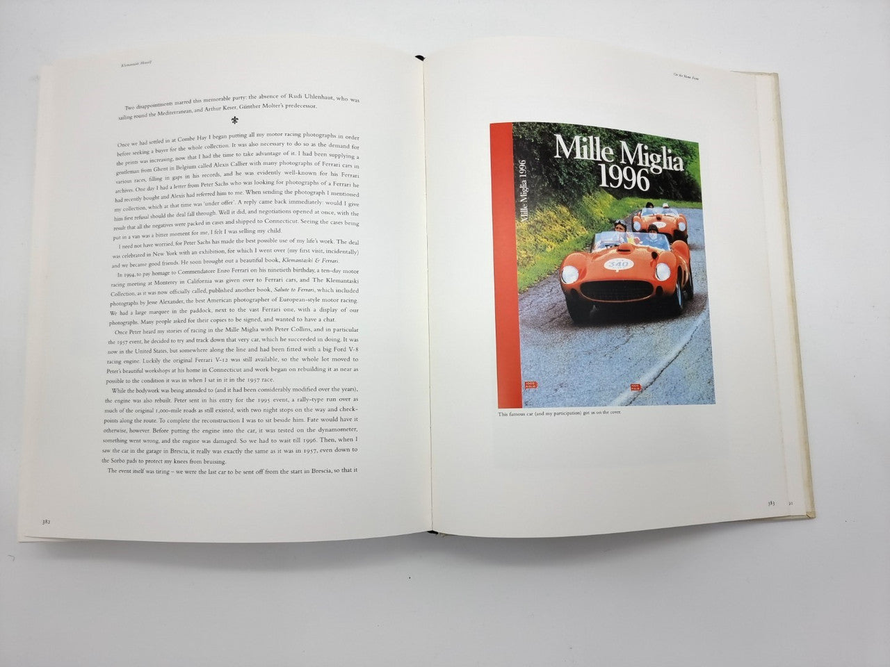 Open photo book with typed text pages and a colorful car racing magazine cover