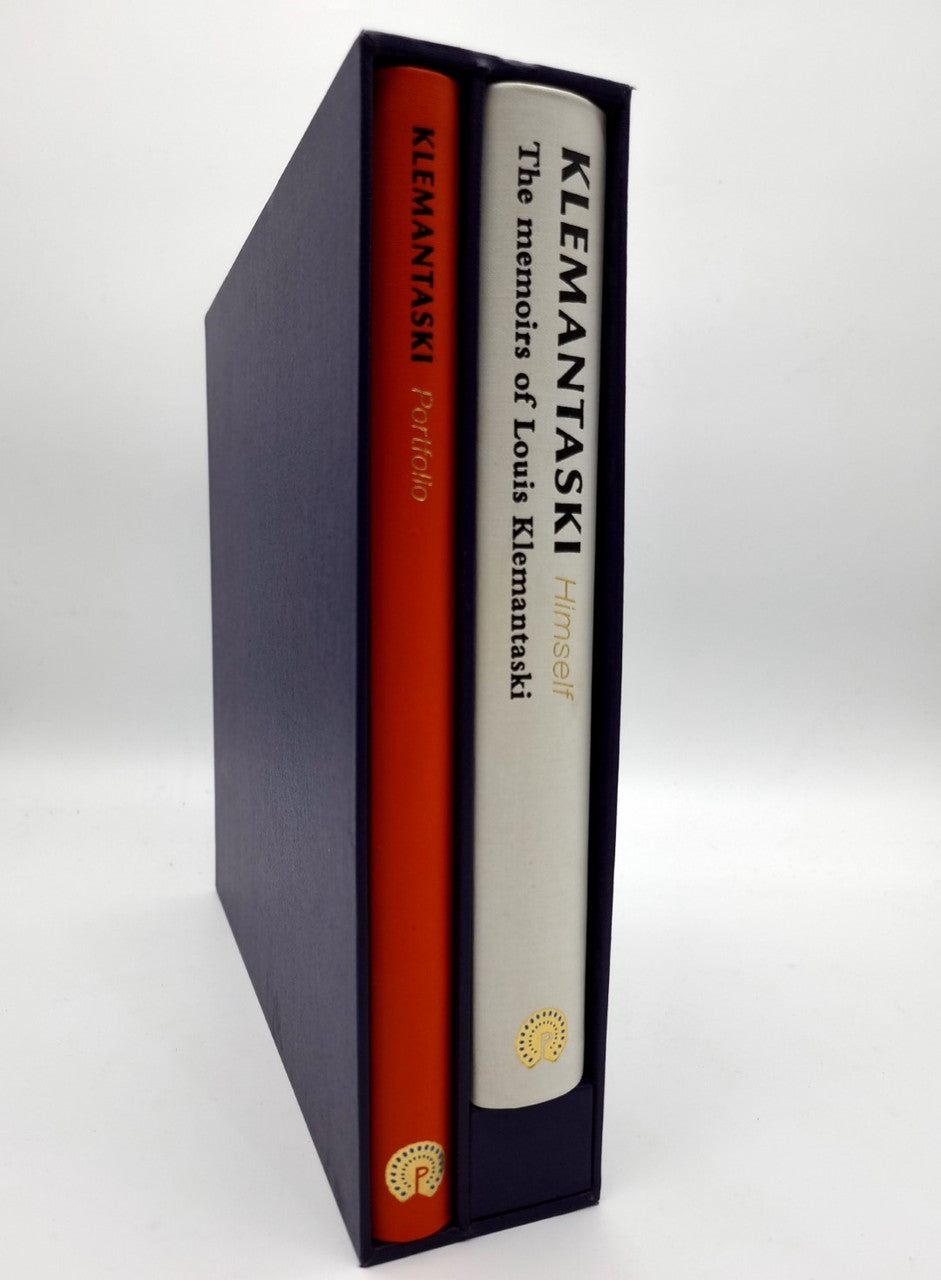Signed photo portfolio book in dark presentation box with orange spine