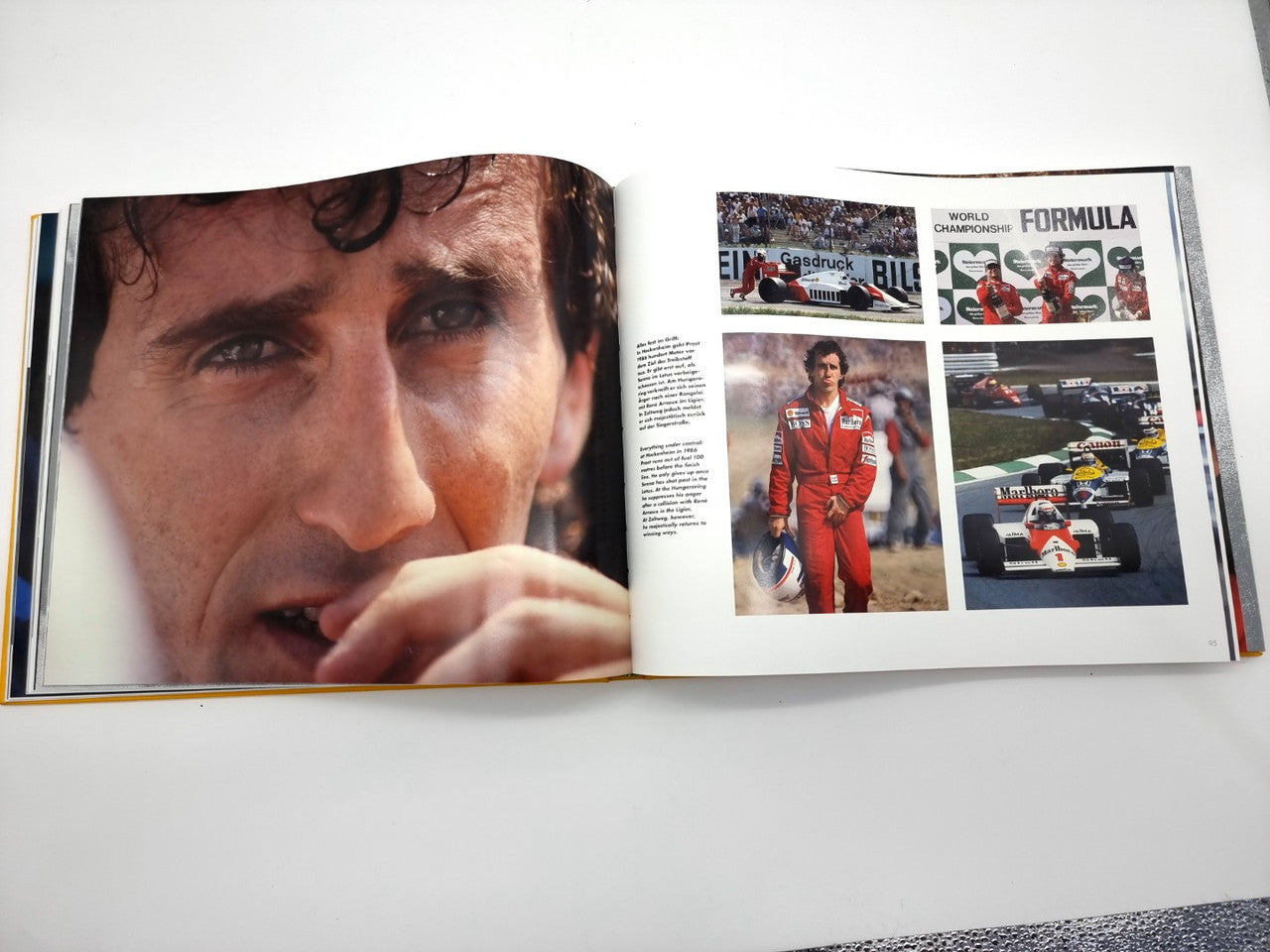 Open motorsport book spread with close-up driver portrait and race photo layout