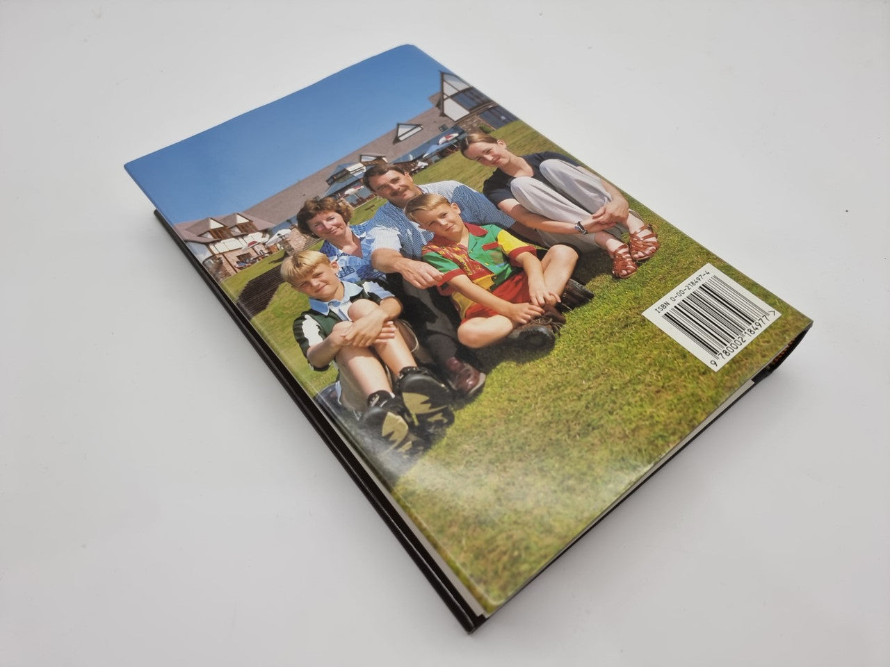 Autobiography book back cover with family photo collage and barcode