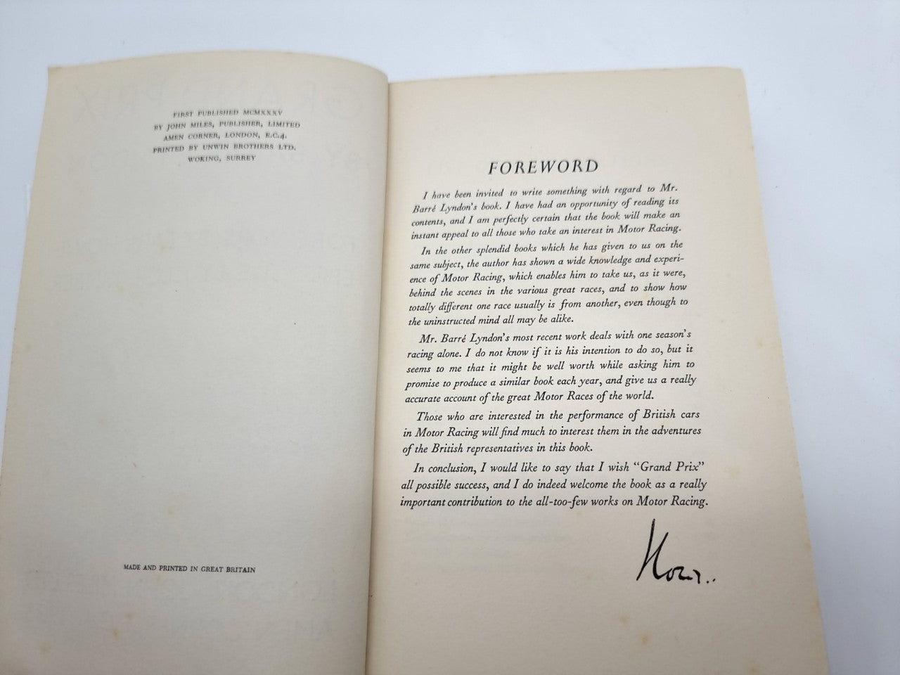 Grand Prix hardback book open to foreword pages with printed text and signature