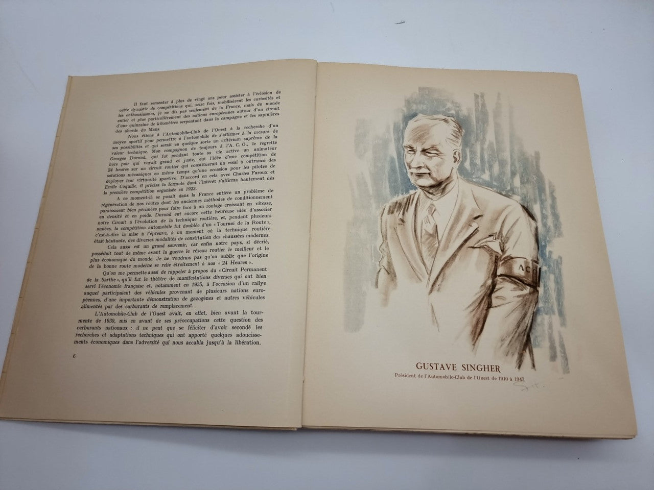 Open book with illustrated portrait of a man on the right page