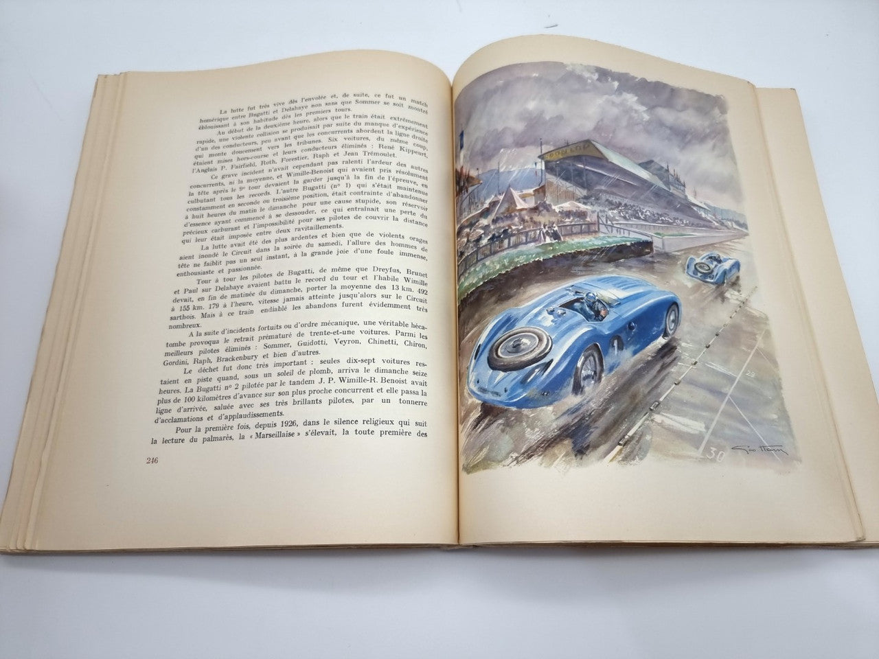 Open book with vintage racing car illustration on the right page