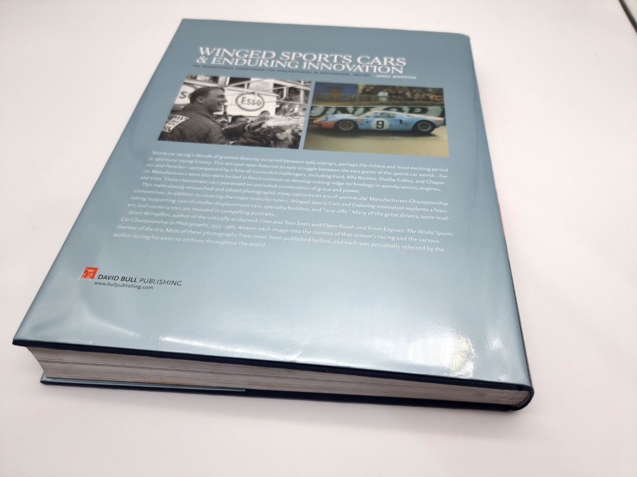 Hardcover book back cover with blue panel, title heading, and small publisher logo