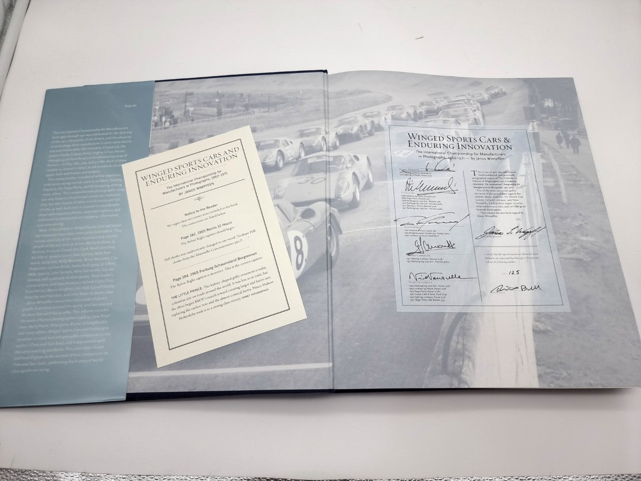 Open book with signed publisher's page and letter insert, laid flat