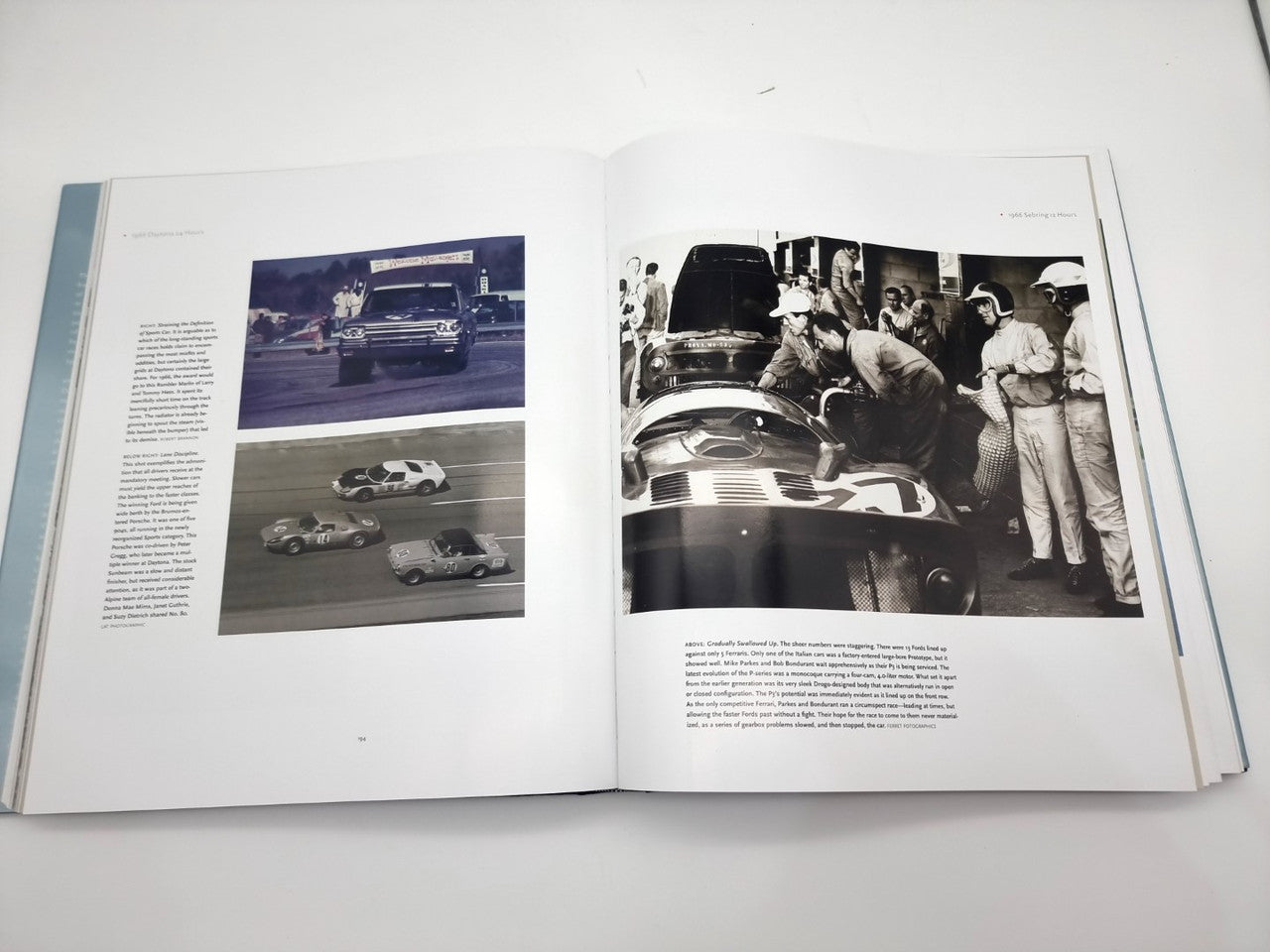Open book spread with two black-and-white race car photo pages and paragraphs